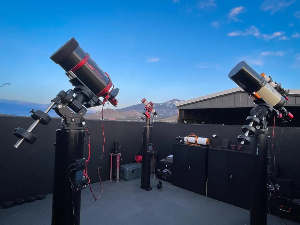 Telescopes inside NAZ Observatory with the mountains of Northern Arizona in the background